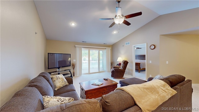 living room featuring carpet flooring, ceiling fan, and vaulted ceiling