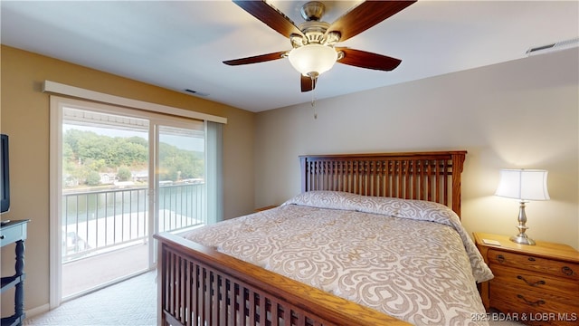 carpeted bedroom featuring access to exterior and ceiling fan