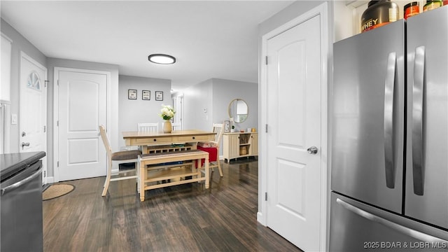 kitchen with dark hardwood / wood-style floors and appliances with stainless steel finishes