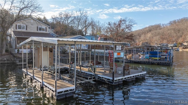 view of dock with a water view and boat lift