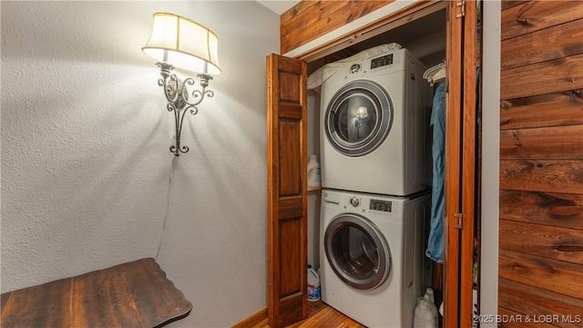 washroom with stacked washer / drying machine