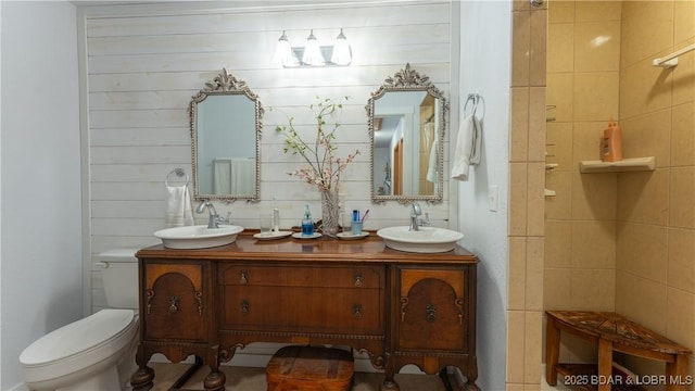 bathroom featuring toilet and vanity