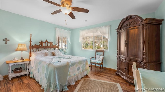 bedroom featuring wood-type flooring and ceiling fan