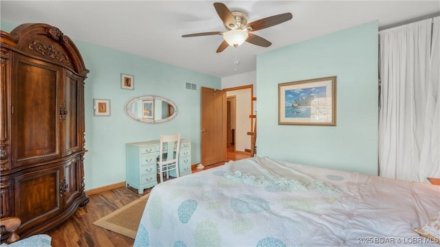 bedroom featuring hardwood / wood-style floors and ceiling fan