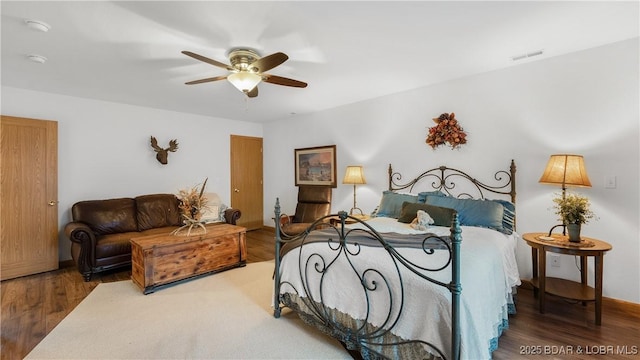 bedroom featuring hardwood / wood-style flooring and ceiling fan