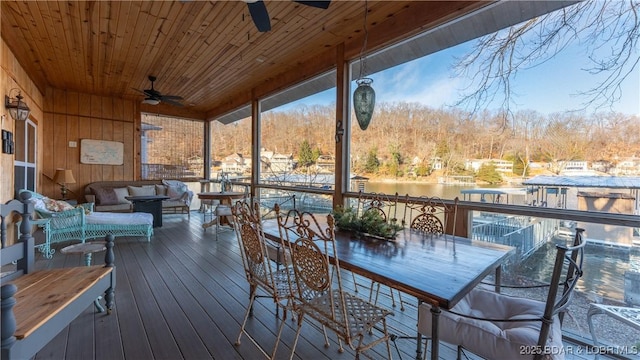 deck featuring an outdoor hangout area, a water view, and ceiling fan