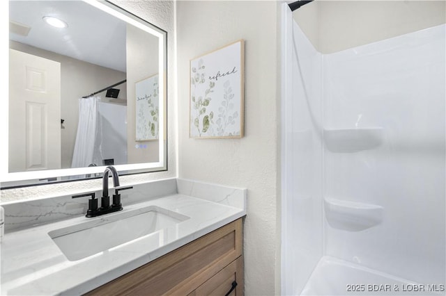 bathroom featuring vanity and a shower with curtain