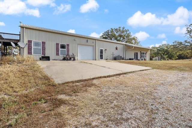 back of property with a garage