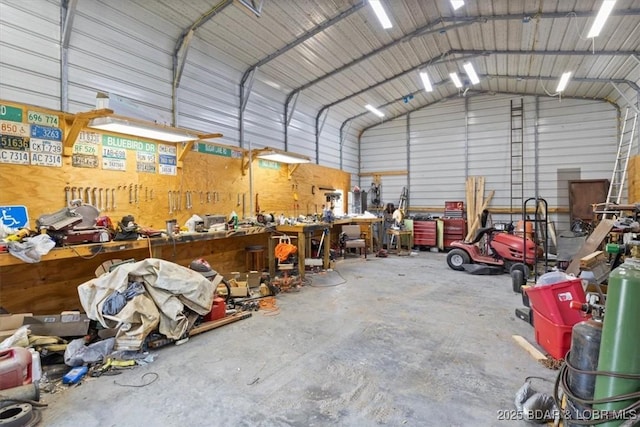 garage featuring metal wall and a workshop area