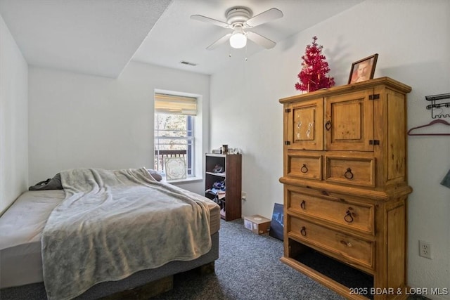 bedroom featuring a ceiling fan and dark colored carpet