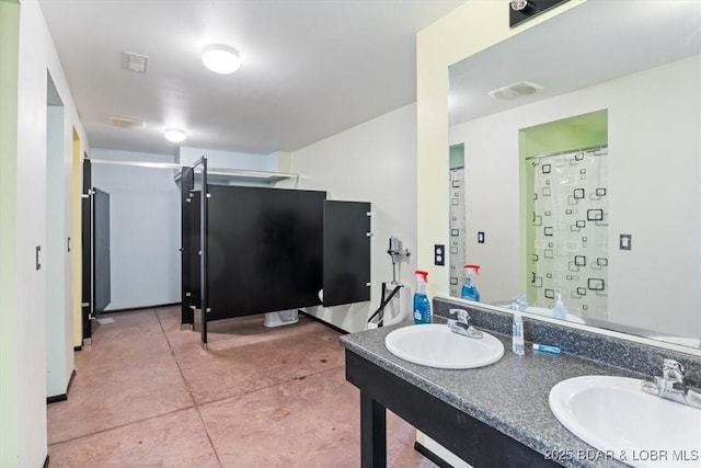 bathroom featuring double vanity and a sink