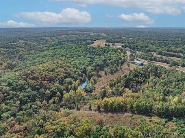 aerial view featuring a view of trees