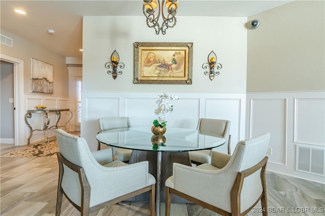 dining space featuring a notable chandelier