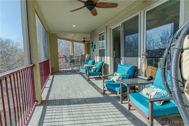 sunroom / solarium with ceiling fan