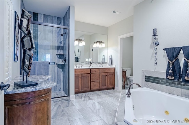 full bathroom featuring toilet, vanity, and shower with separate bathtub