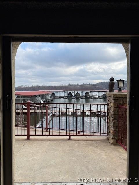 view of patio with a water view