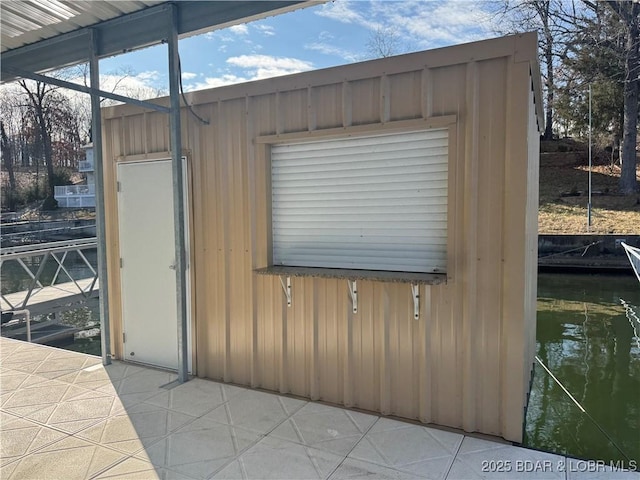 view of outbuilding with a water view