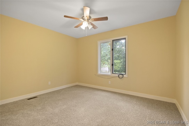 spare room with carpet floors and ceiling fan