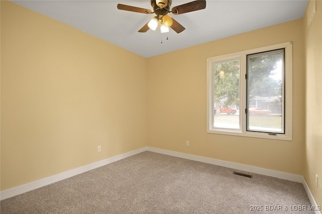 carpeted empty room with ceiling fan