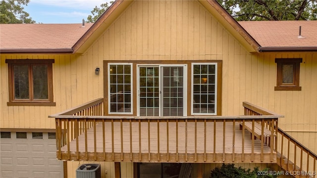 exterior space featuring a garage and central AC