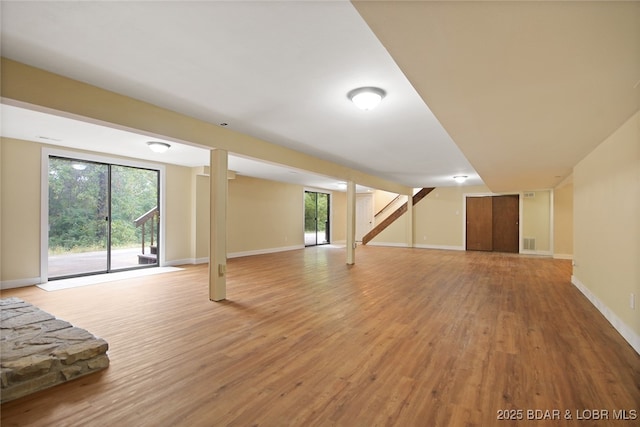 basement with hardwood / wood-style floors