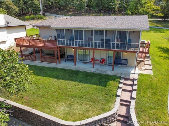 back of house with a yard, a patio area, and a wooden deck