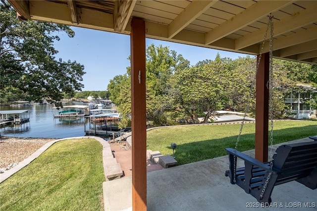 view of patio / terrace featuring a water view and a boat dock