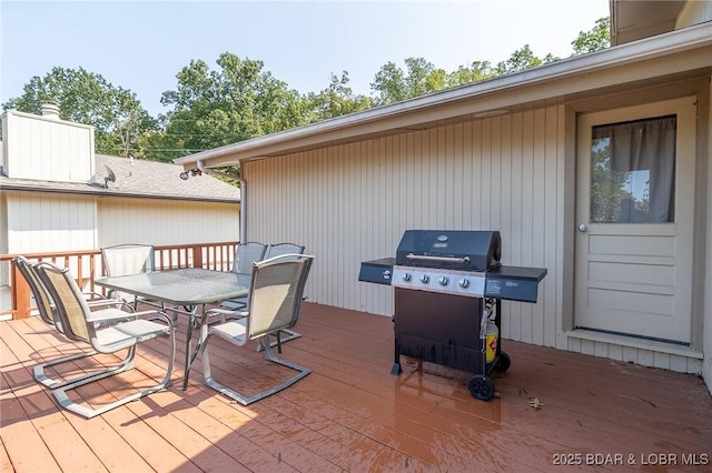 wooden terrace with area for grilling