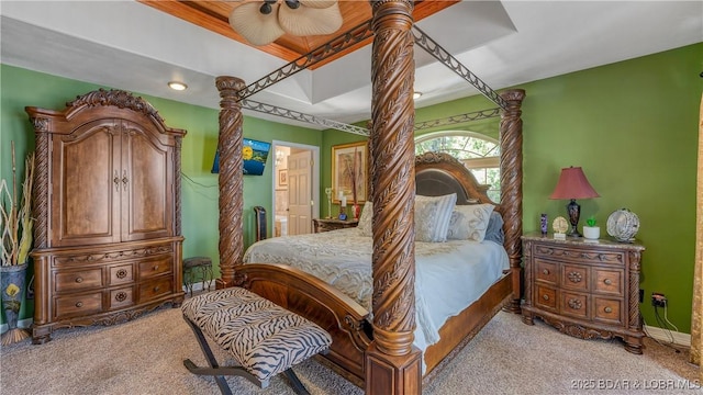 bedroom featuring light carpet and ceiling fan