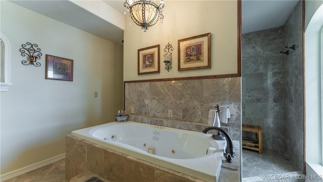 bathroom with plus walk in shower and a chandelier