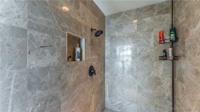 bathroom featuring tiled shower