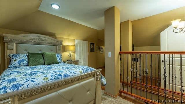 bedroom with lofted ceiling