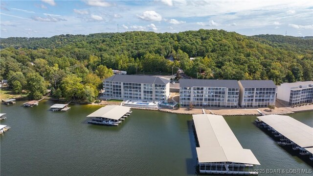 birds eye view of property with a water view