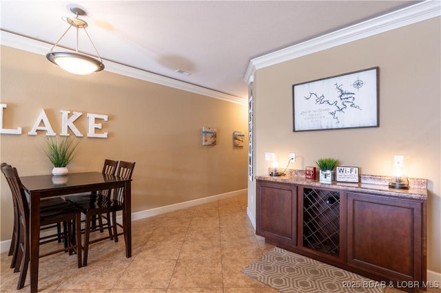 tiled dining room with crown molding