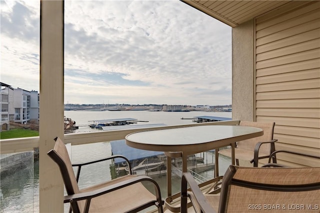 balcony featuring a water view