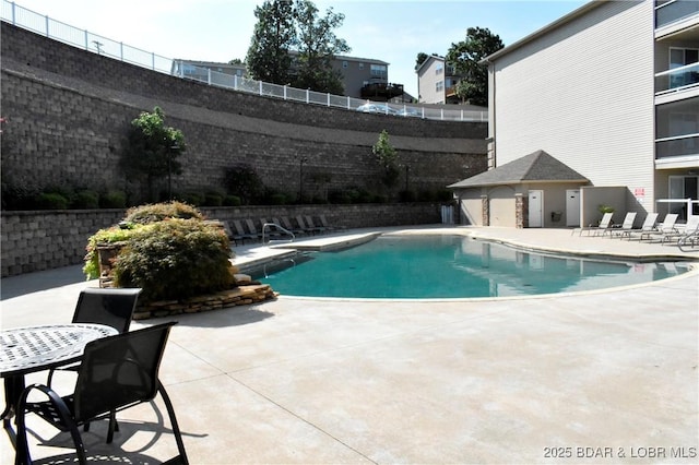 view of pool featuring a patio