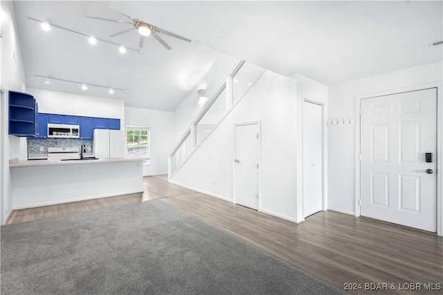 unfurnished living room with sink, ceiling fan, and dark wood-type flooring