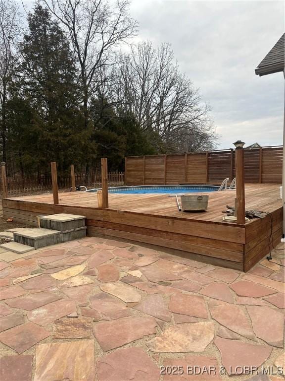 view of patio / terrace featuring a swimming pool side deck