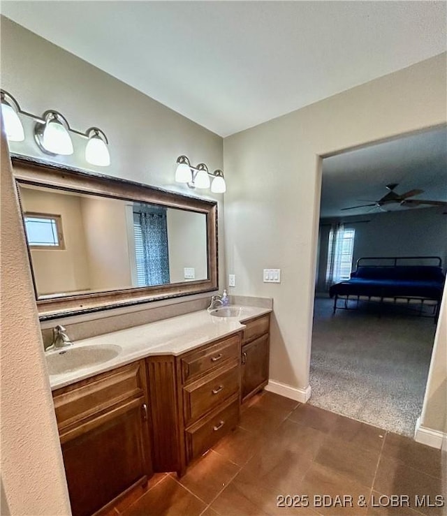 bathroom with tile patterned floors and vanity