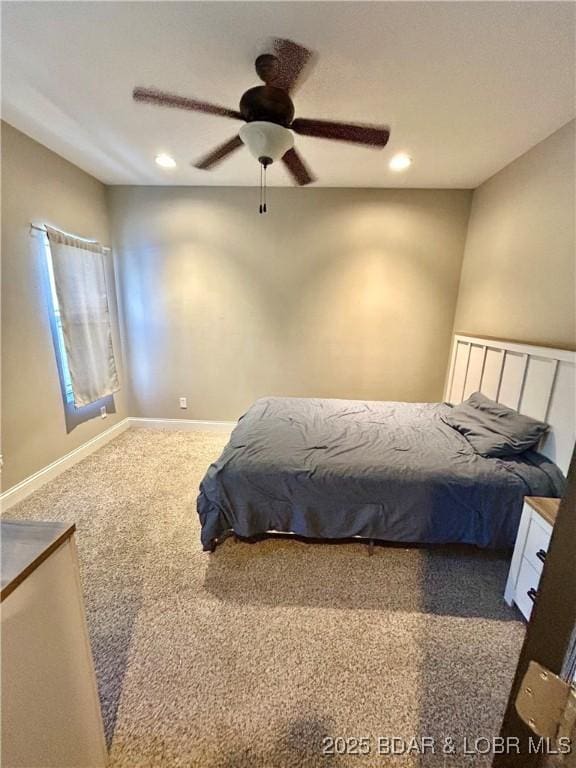 carpeted bedroom featuring ceiling fan