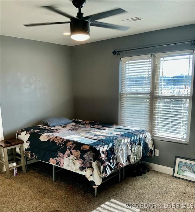 carpeted bedroom with ceiling fan