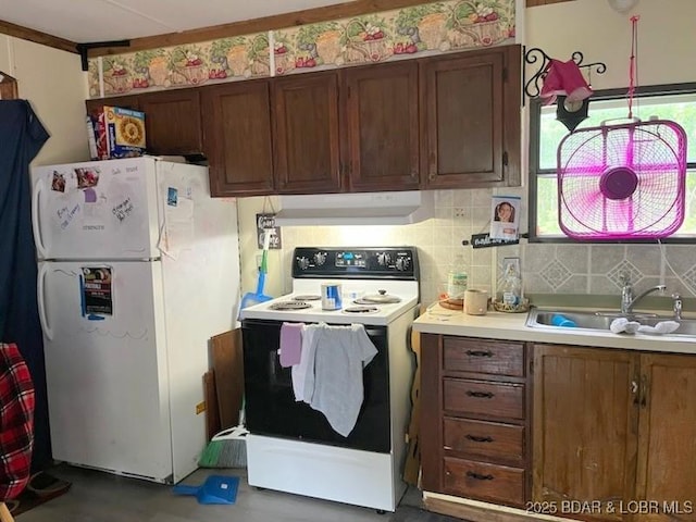 kitchen with white appliances and sink