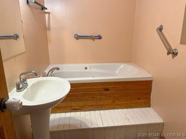 bathroom featuring a tub to relax in