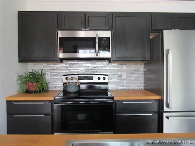 kitchen featuring appliances with stainless steel finishes and backsplash