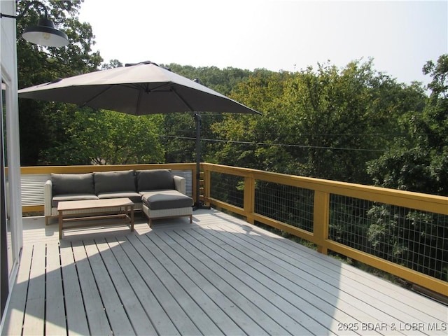 wooden deck featuring outdoor lounge area