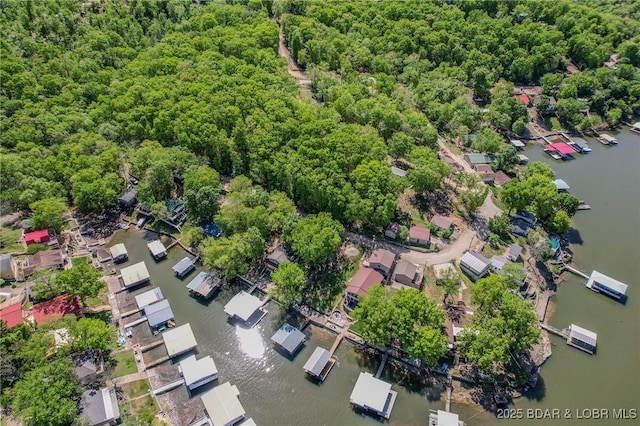 drone / aerial view with a water view and a residential view