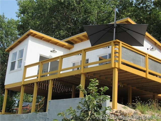 view of side of property with a wooden deck