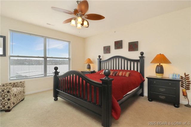 bedroom with visible vents, baseboards, carpet, and ceiling fan