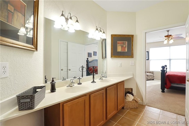 full bathroom with tile patterned flooring, double vanity, ceiling fan, and a sink