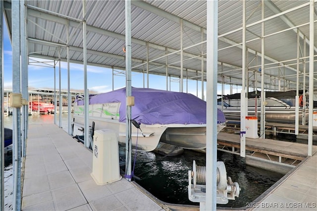 view of dock featuring a water view and boat lift